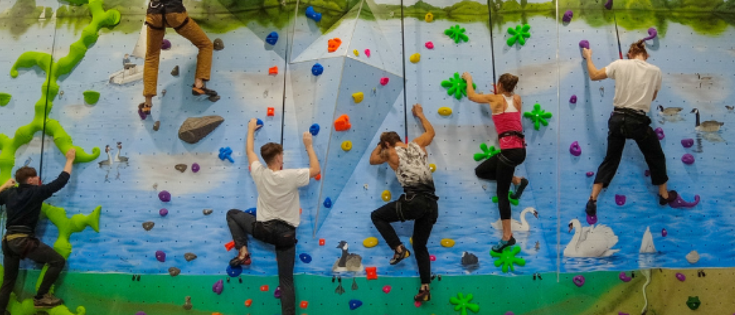 Children climbing the indoor wall at Dinton Activity Centre